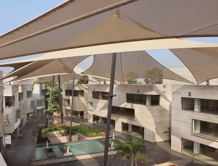 retail and business park - retail -  service facilities - restaurants - new construction - Mondeal Retail Park Ahmedabad - birds eye view onto plaza - shading sails in detail